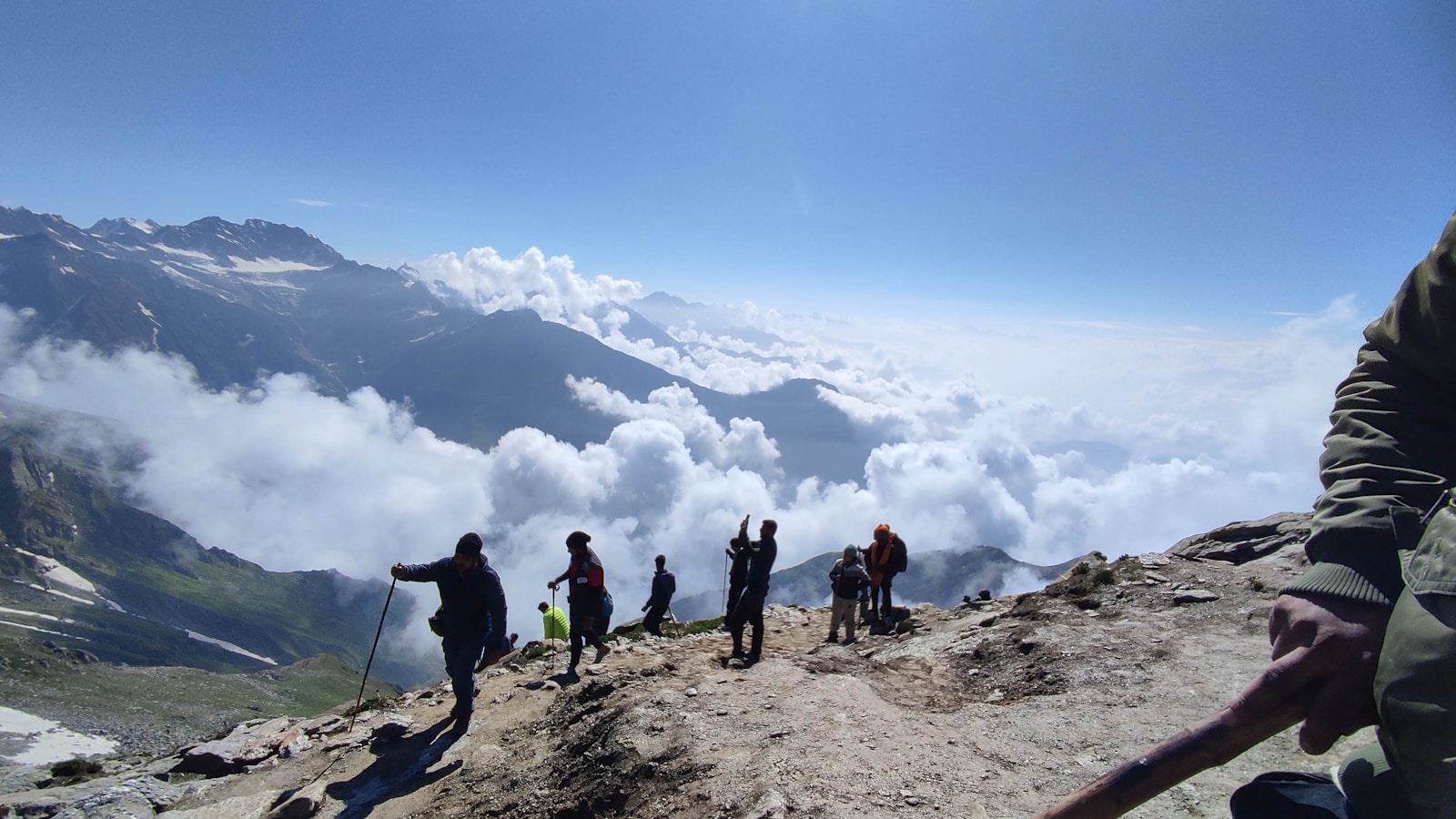 A group of people standing on top of a mountain