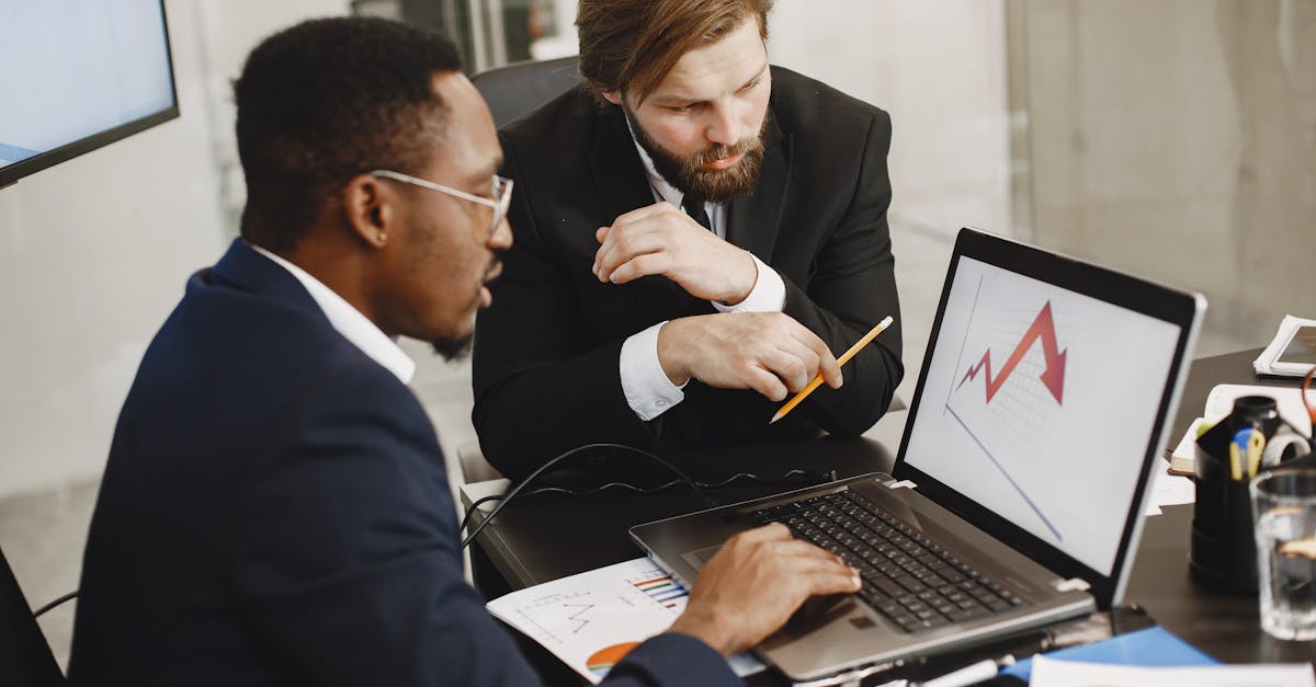 A person analyzing charts and graphs on a computer screen, representing business growth and data analysis.